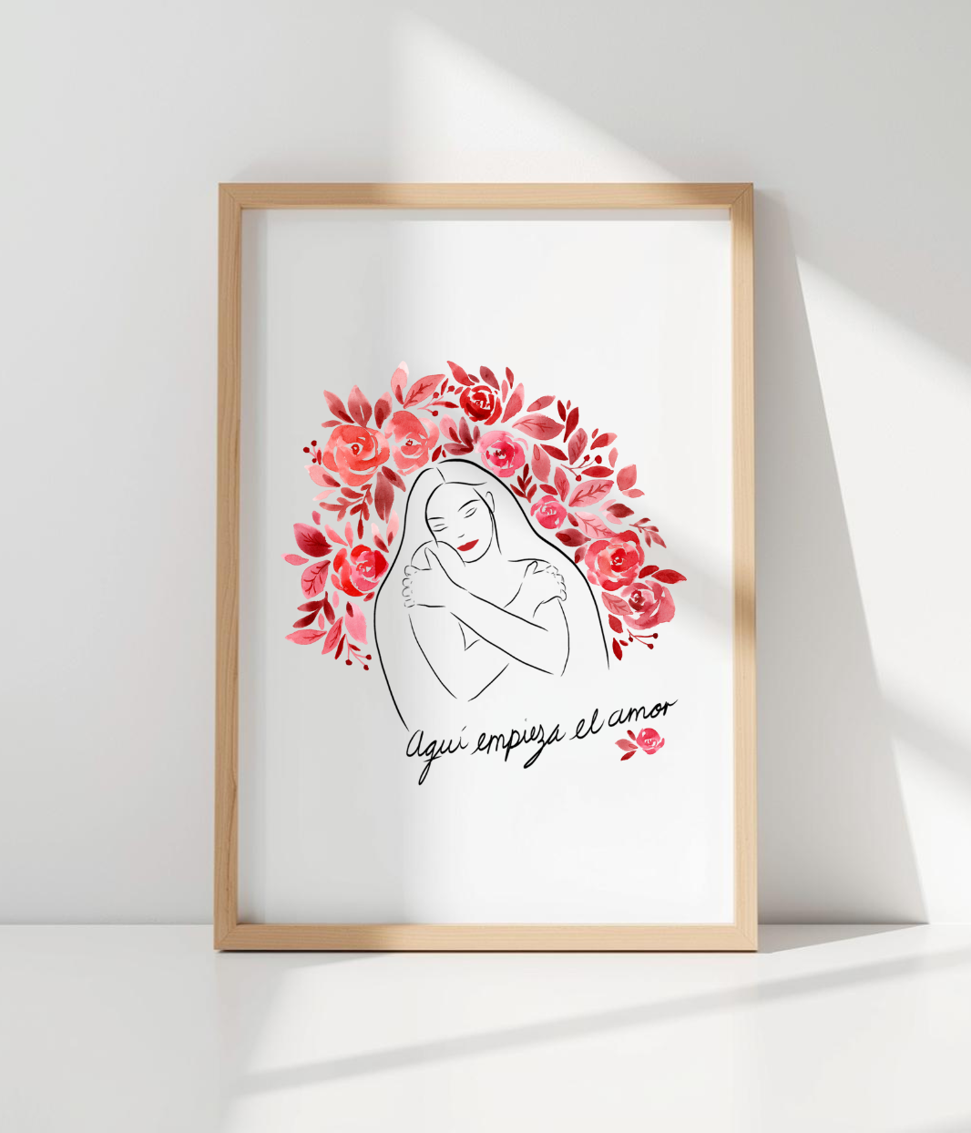 Affiche illustrée représentant une femme entourée de fleurs roses accompagné du message 'Aquí empieza el amor'. Modèle "Amour de soi" en collaboration avec Aby, conçu et imprimé à Lyon par la marque éthique Leonor Roversi.