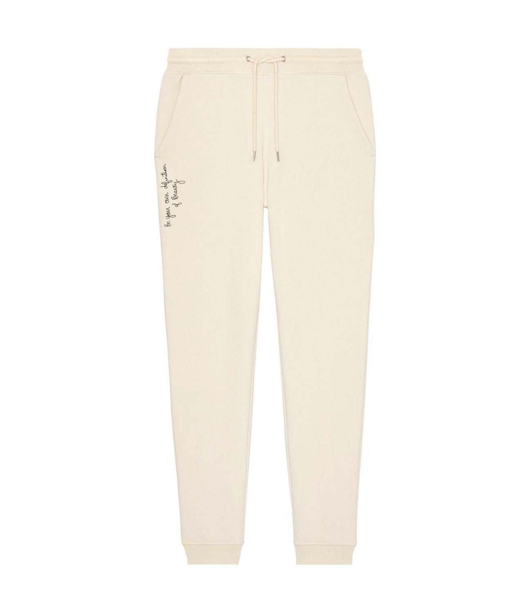Mock-up d'un jogging pour femme en coton bio noir, imprimé blanc de l'inscription "be your own definition of beauty" à l'avant sur le côté. Modèle Sekhmet, conçu et imprimé à Lyon par la marque éthique Leonor Roversi